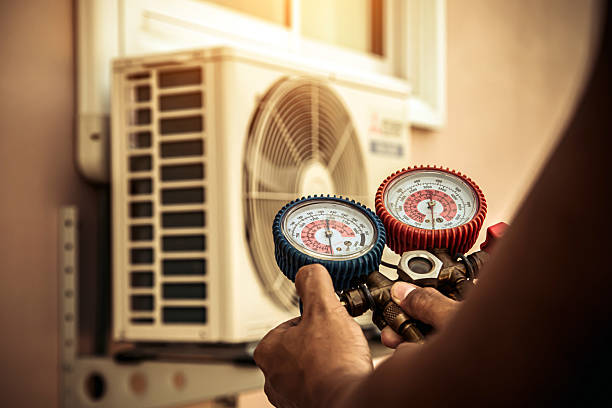Professional Air Conditioning Service technician working in Troy, AL